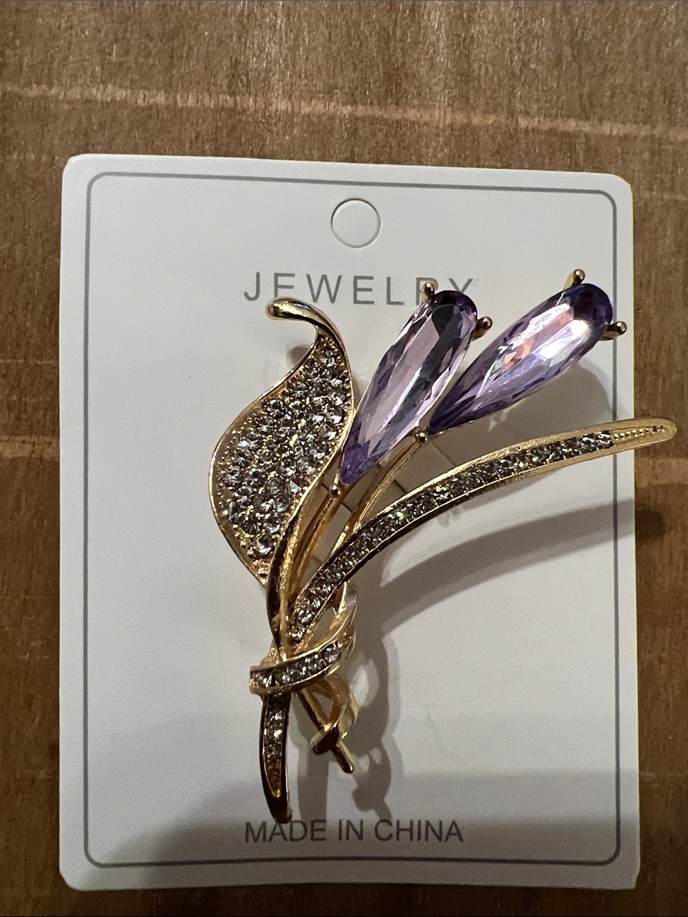 3/$18 Gold Tone Floral Brooch with Purple Crystal Accents - Lot 445